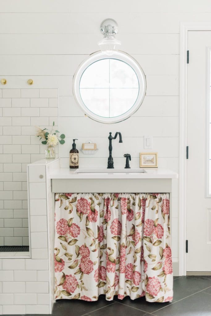 A simple spray of stems in adds a touch of fall to the sink area