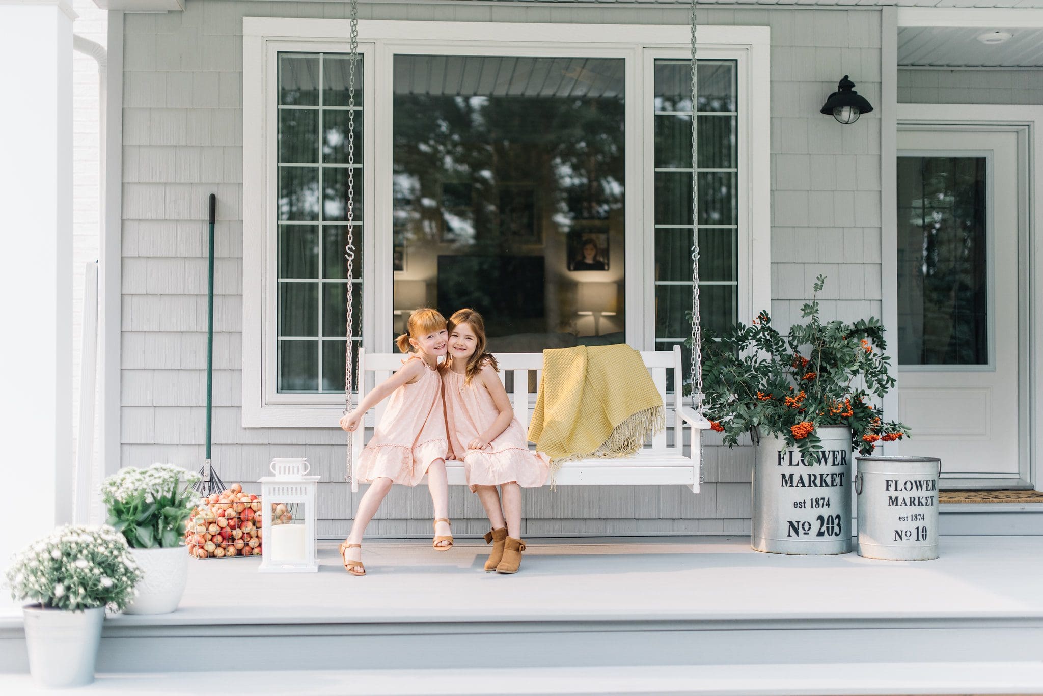 Simple Fall home decor ideas such as foraged branches and pots of white mums