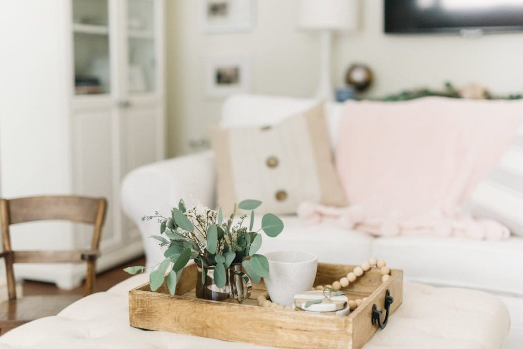 Eucalyptus cuttings look fresh in a vintage jug on the the ottoman and dry well lasting all fall