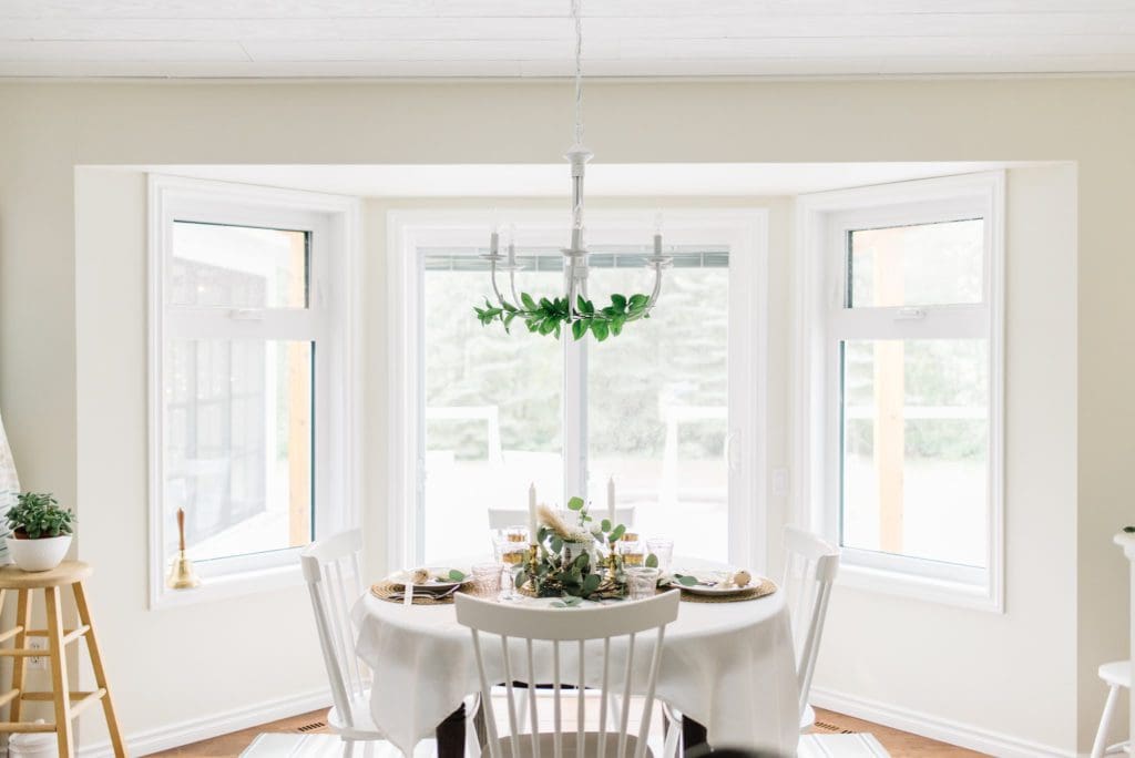 dining room with greens on the chandelier