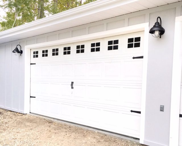 Garage door makeover for less than $100 using magic erasers and magnets