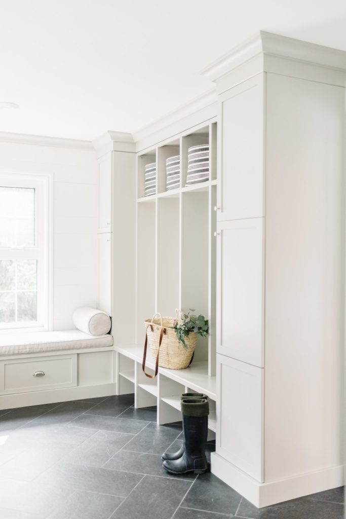 A combination of open and closed storage works well for both convenience and clutter control in this mudroom design