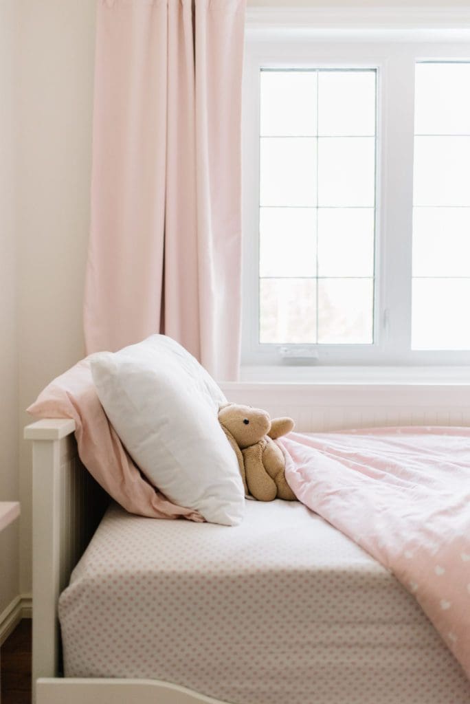 A daybed doubles as a couch in this small bedroom