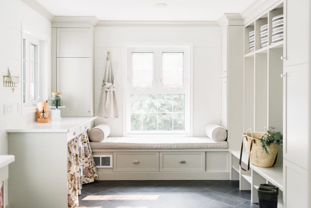 Small space living requires organization.  A well designed mudroom has designated storage areas to handle clutter.