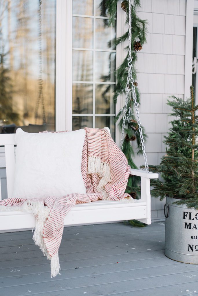 Cozy winter front porch swing at the Ginger home