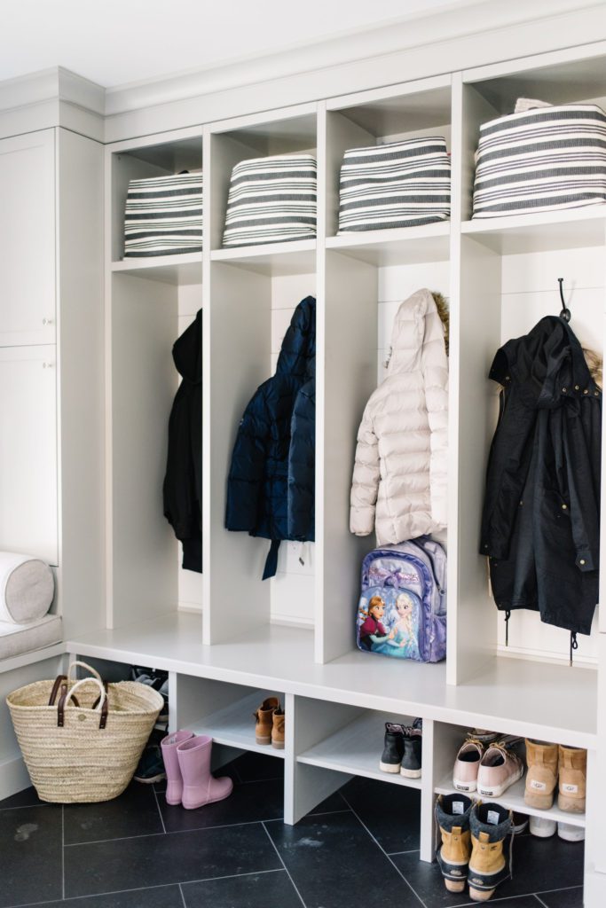 Mudroom cabinetry with jackets hanging up