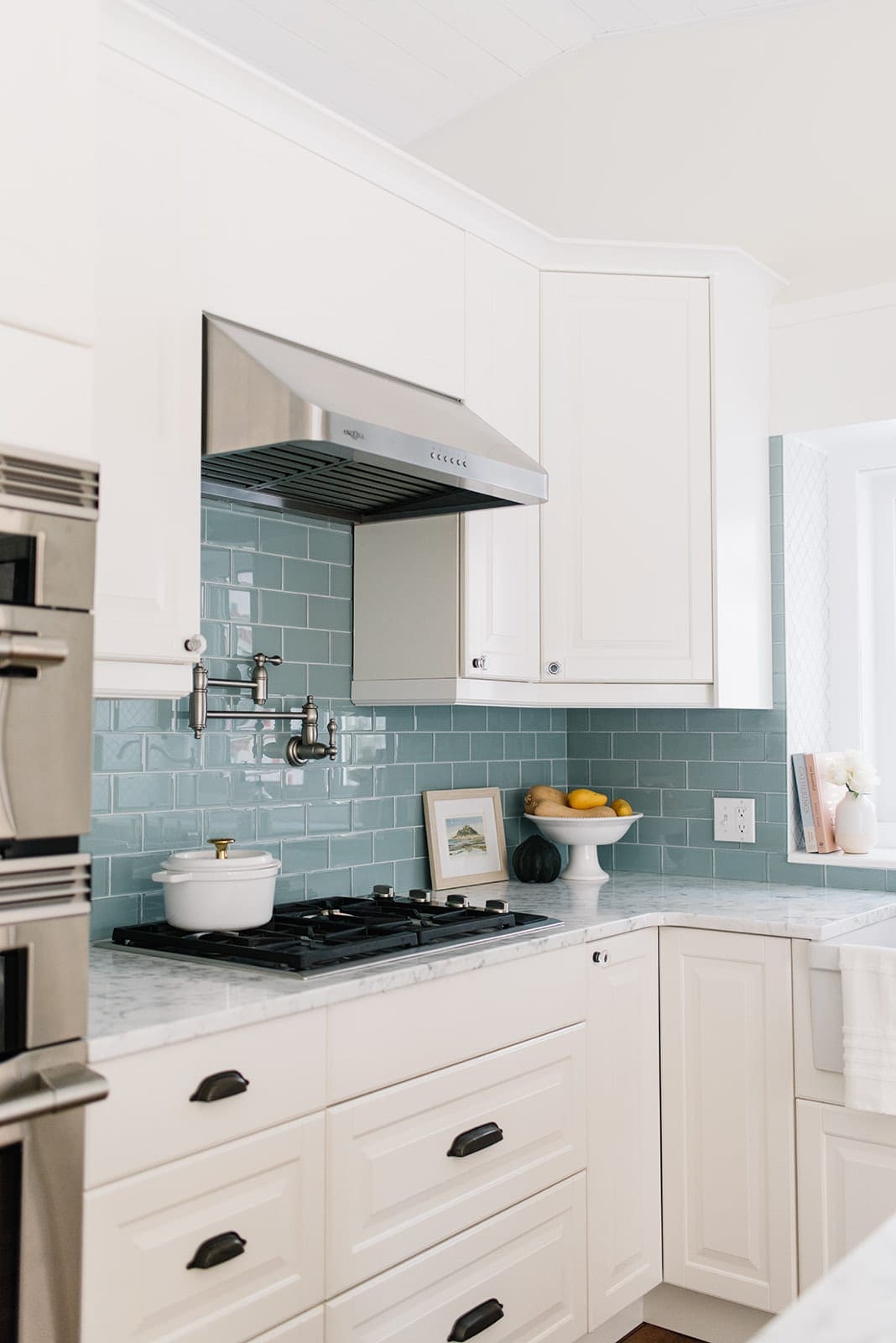 white kitchen with blue tile