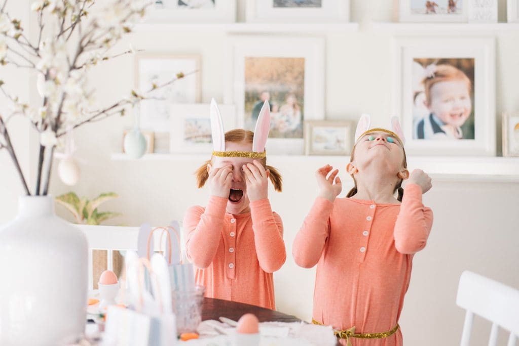 2 little girls play with Easter eggs