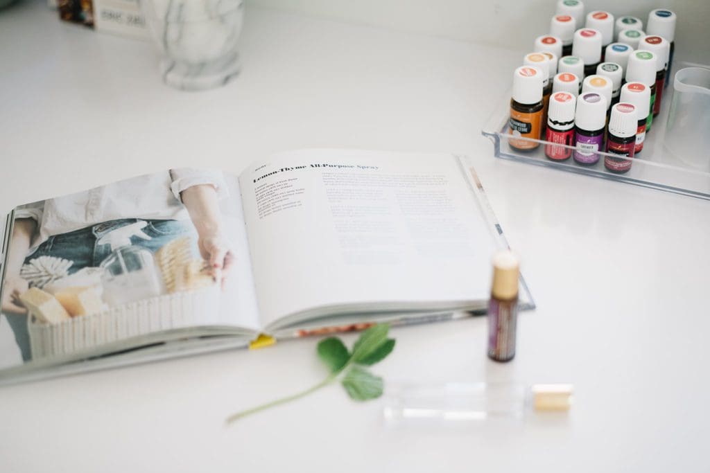 A close up of a book and essential oils