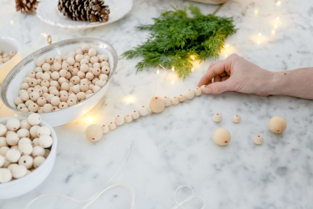 Making wooden bead garlands