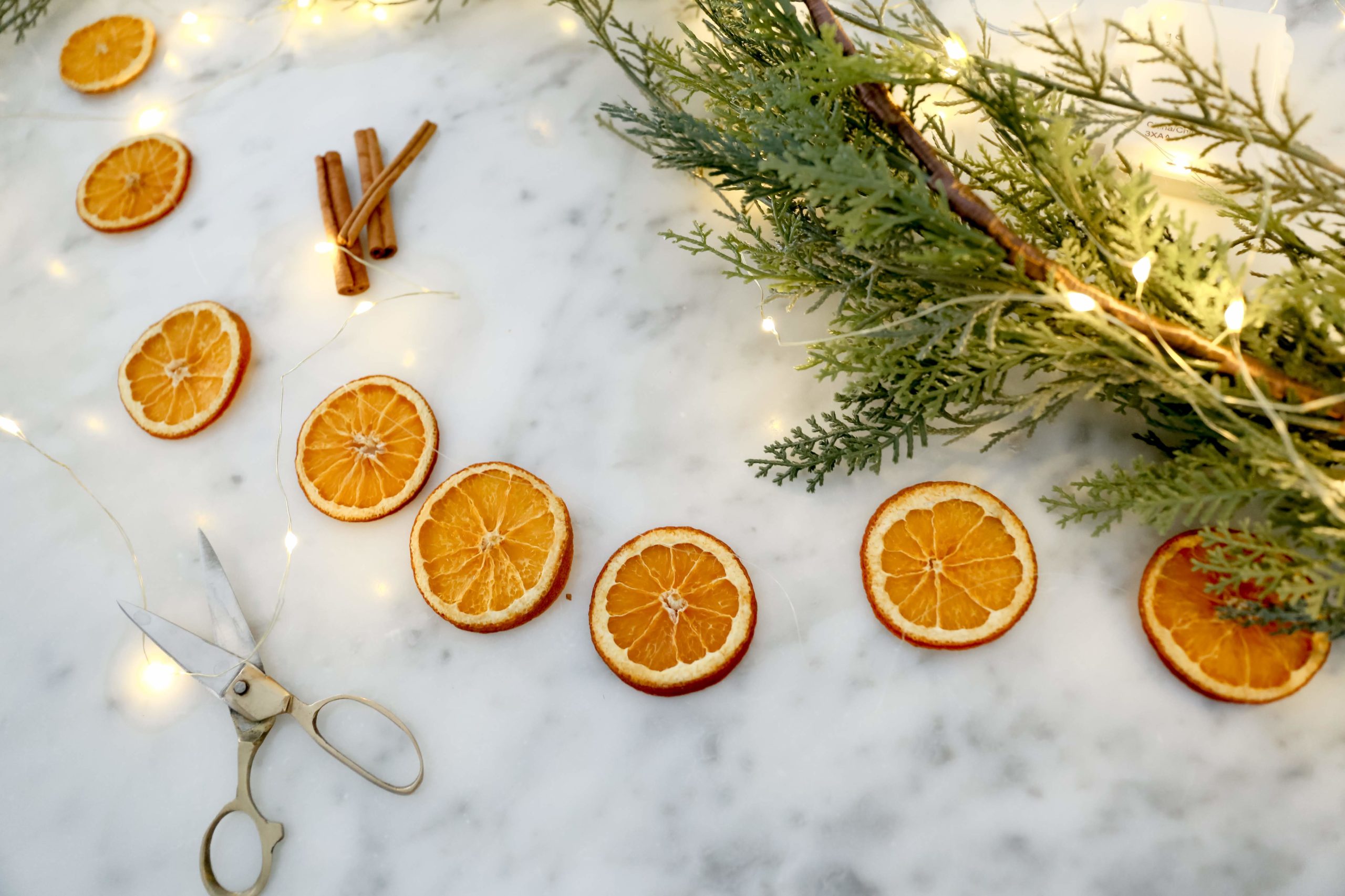 dried orange garland on a marble countertop
