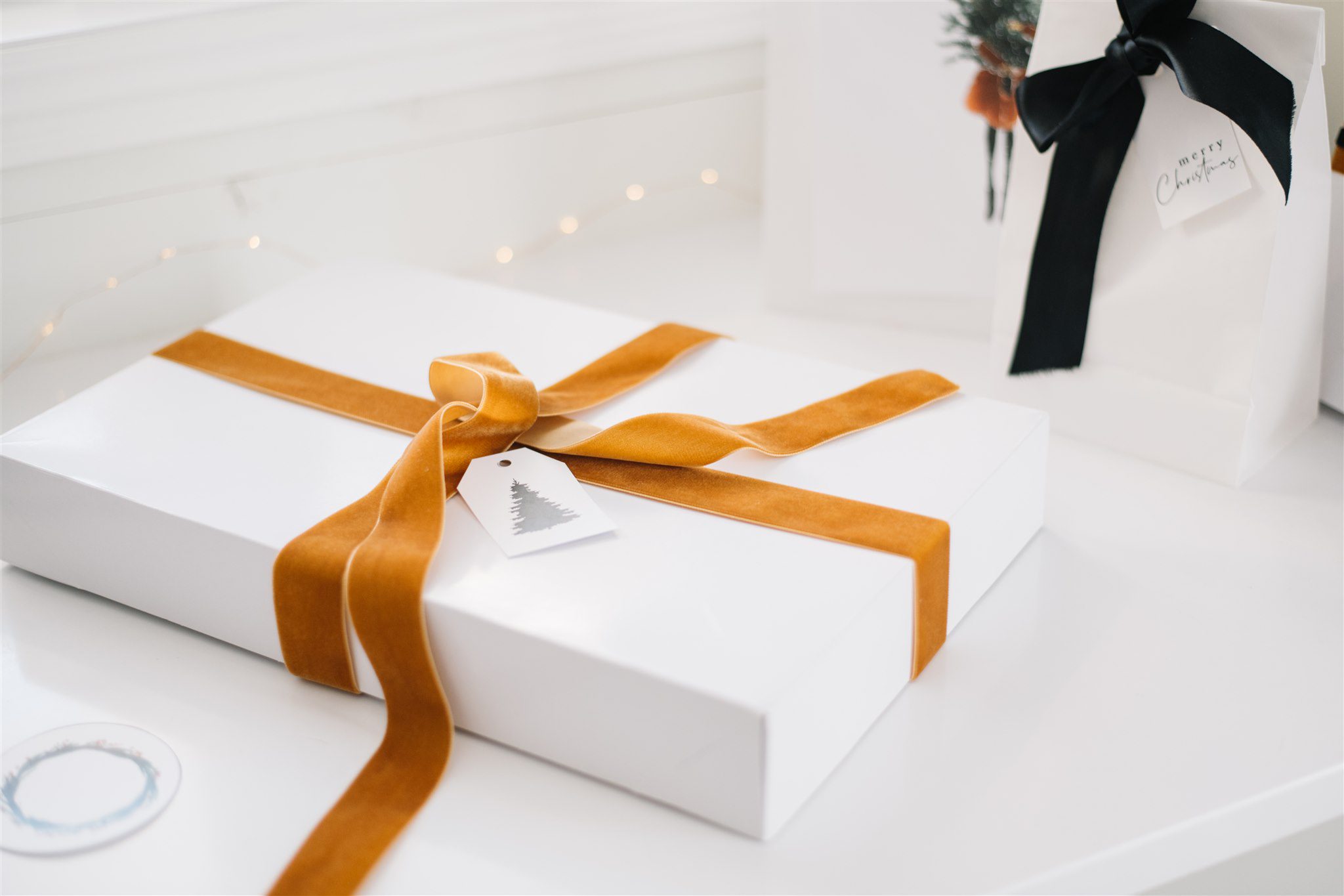 simple white box wrapped with burnt orange velvet ribbon