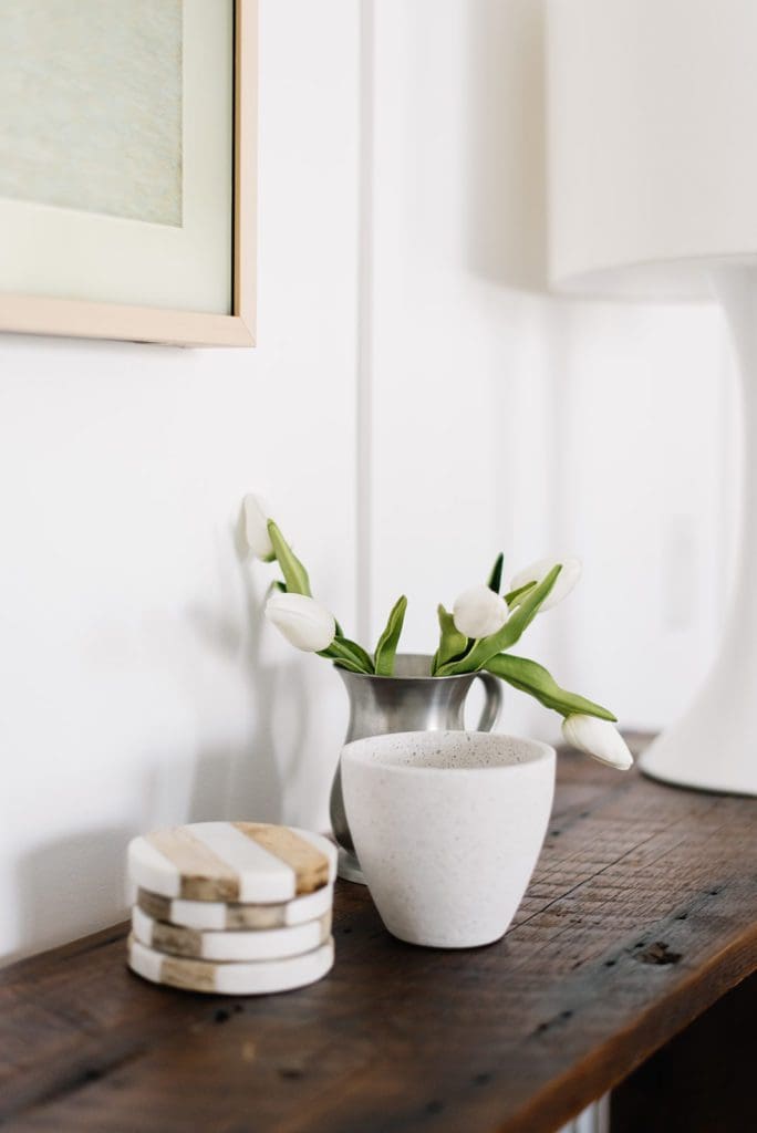 A vase of flowers sitting on top of a wooden table