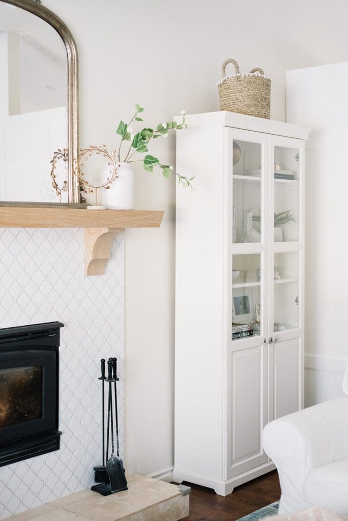 white bookcase in the corner of the living room