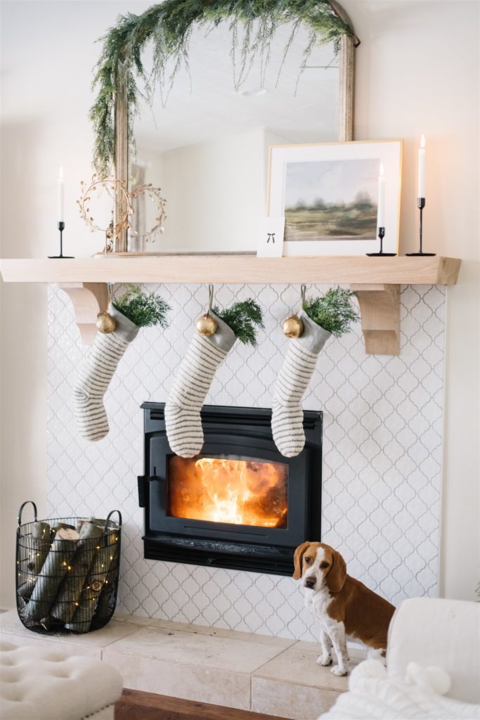 stockings hung in front of a roaring fire