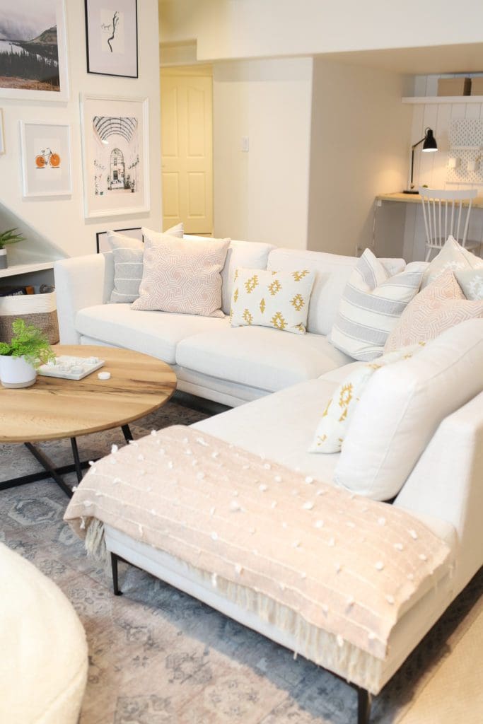 basement living room with large white sectional