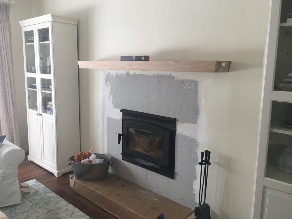 A fire place with mantle being installed above