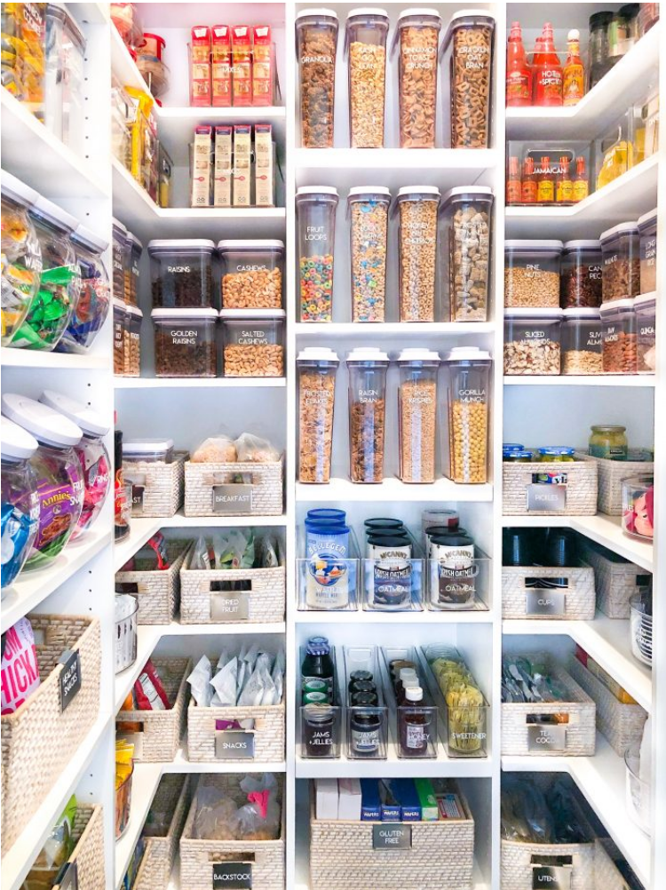 An organized pantry with food organized by colour