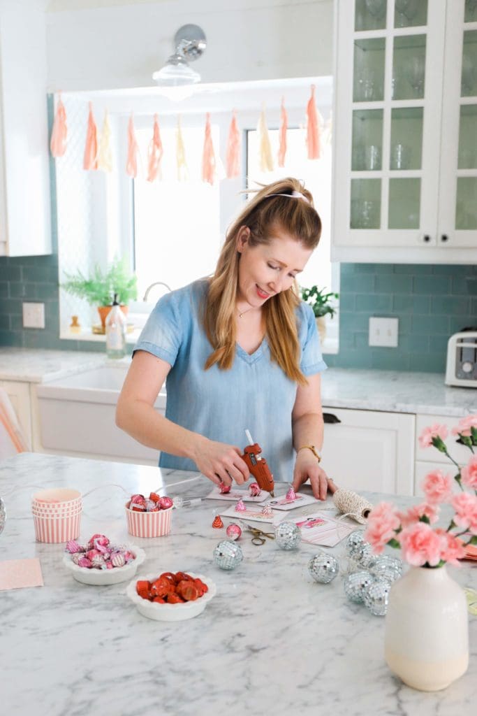 glueing candies onto valentine\'s day cards