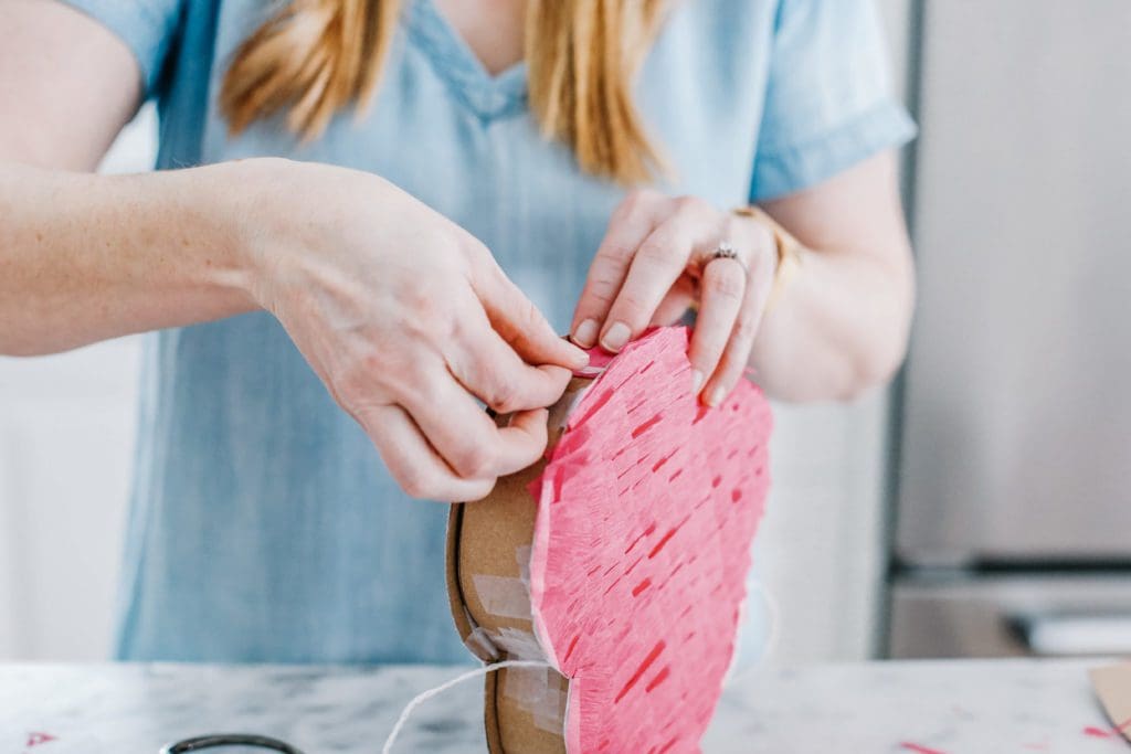 taping heart pinata