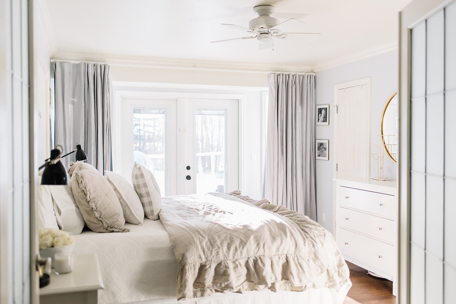 bedroom with king sized bed and ruffled duvet cover