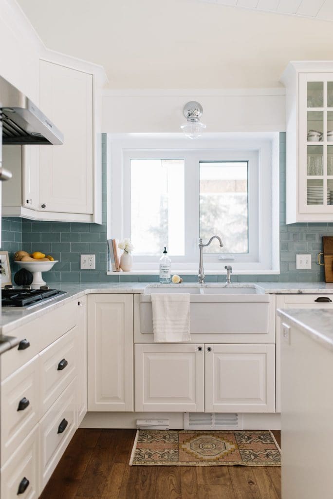 A kitchen with a sink and a window