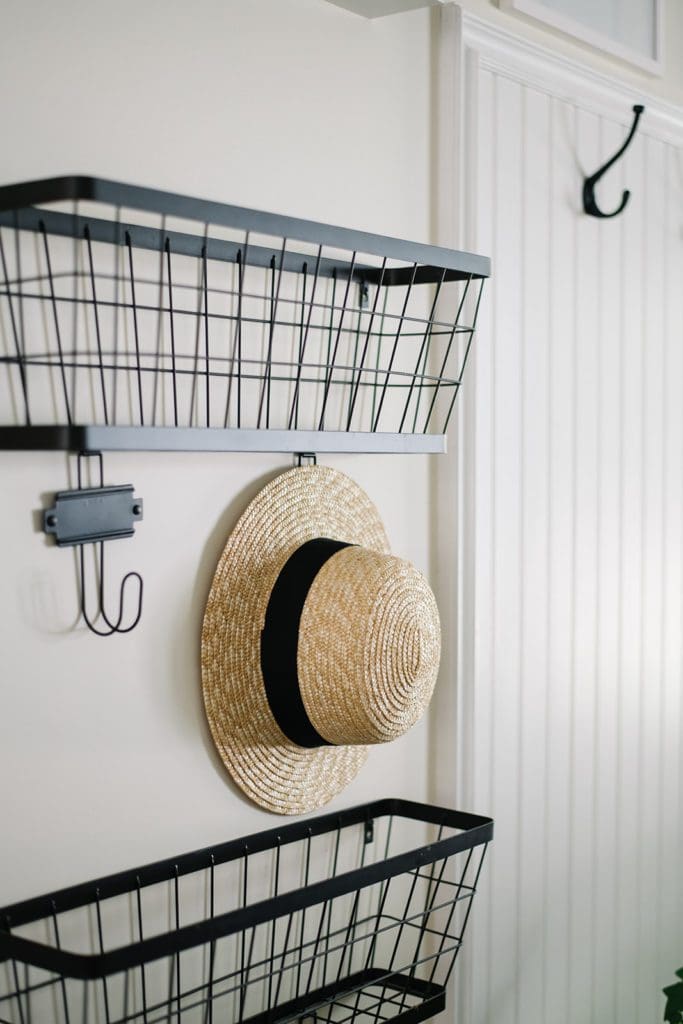 sun hat hangs on basket hook