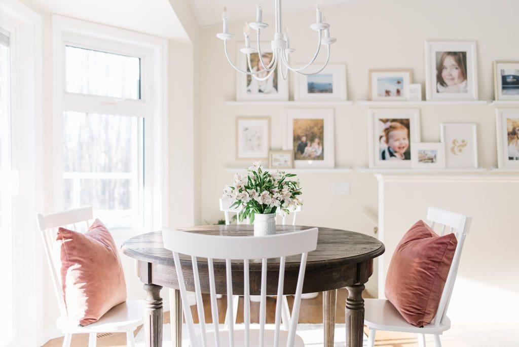 A dining room table in front of a window