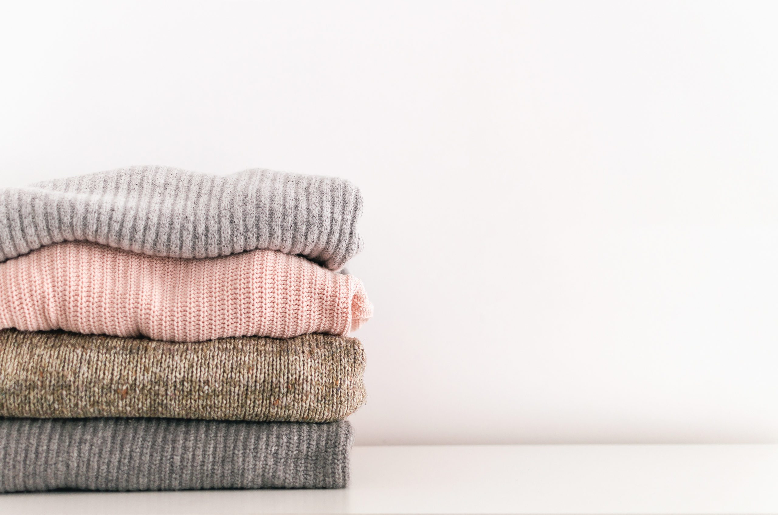stack of folded sweaters