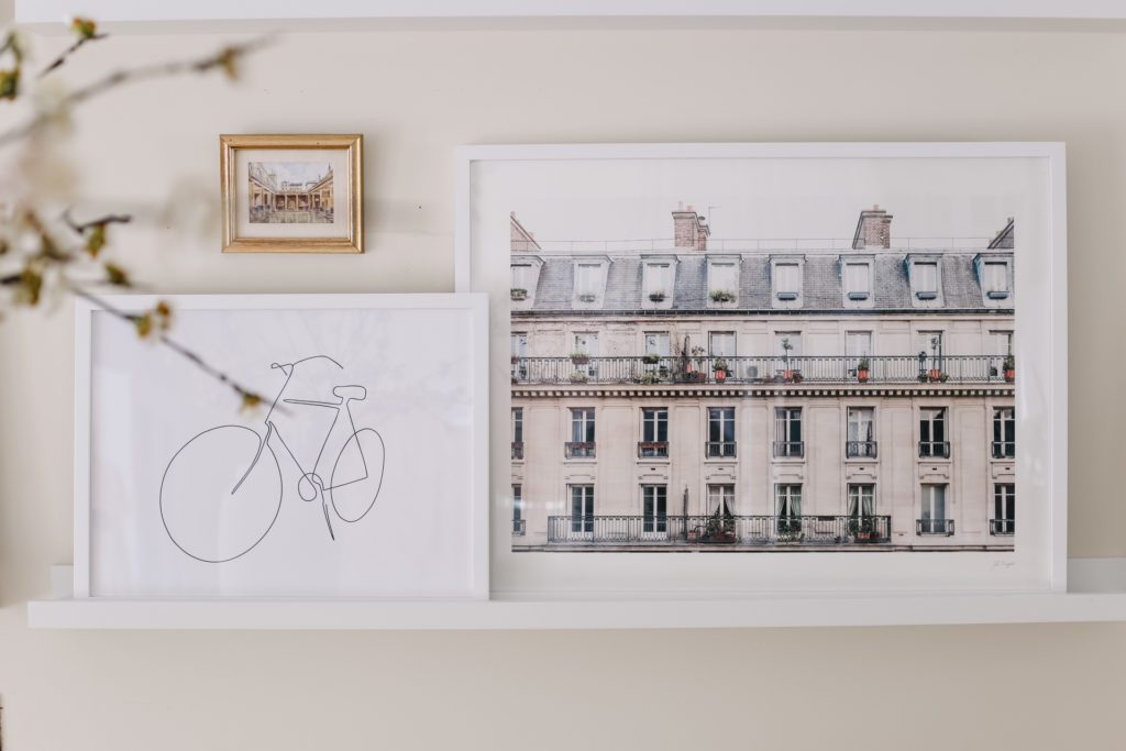 Framed prints of a bicycle and French building