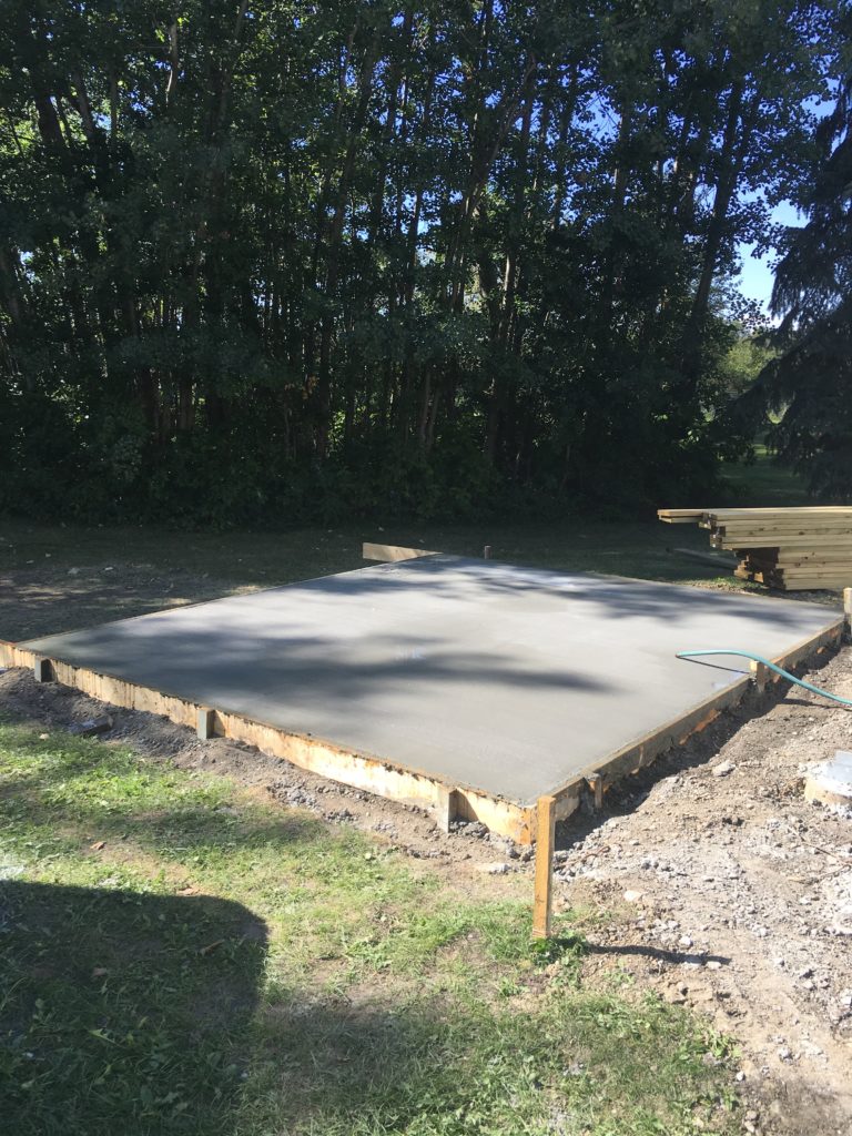 a concrete pad poured in wooden framing