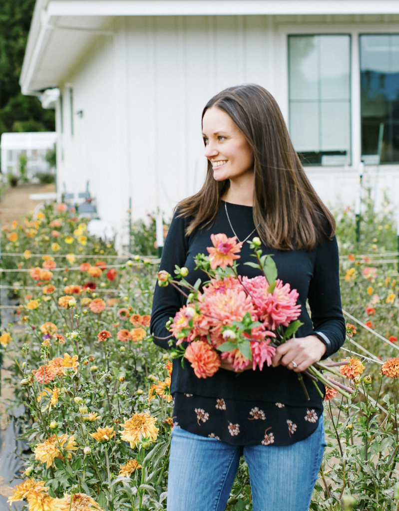 Jen from The Flowering Farmhouse holding a bouquet of fresh cut flowers