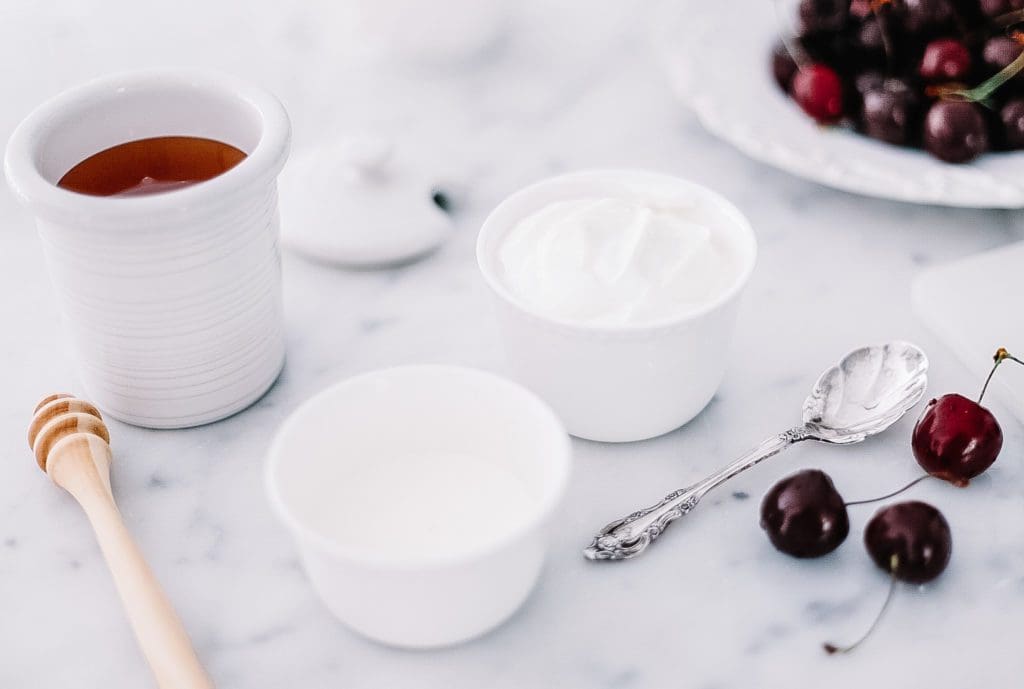 ingredients in white bowls on marble counter