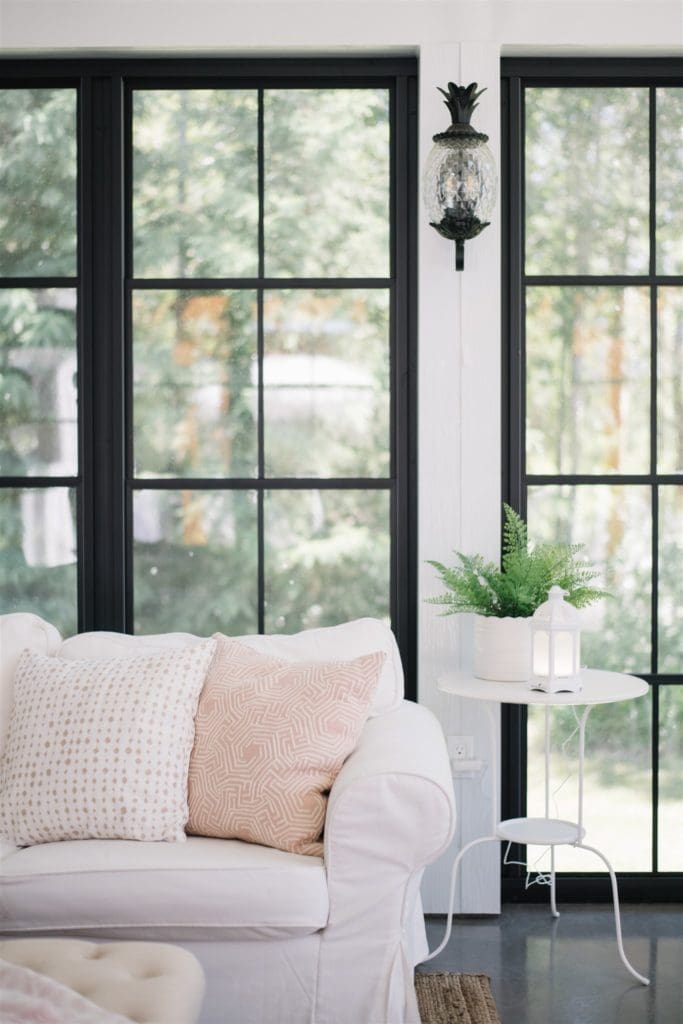 diffuser sits on a side table in a sun room