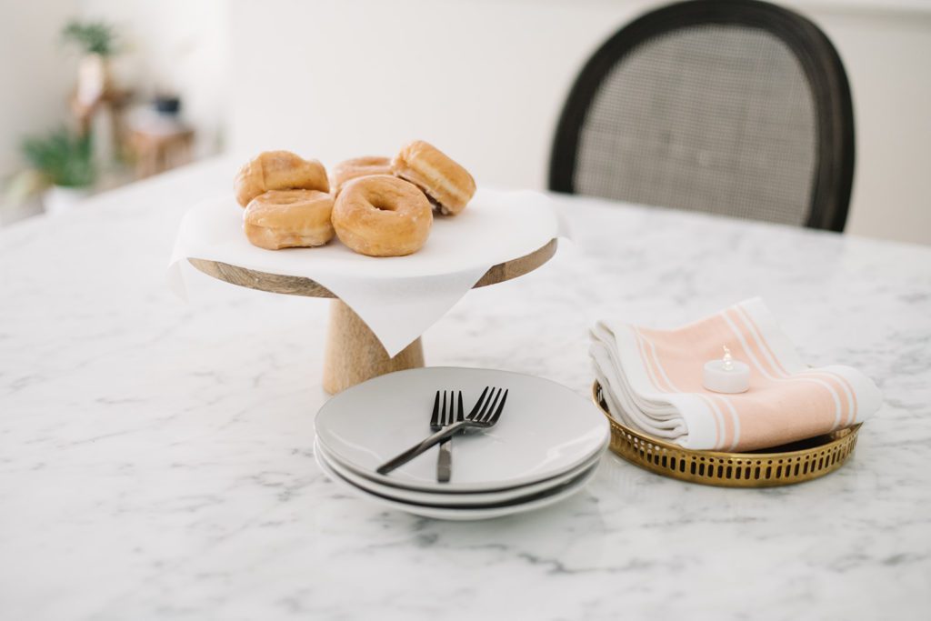 A cake pedestal with donuts