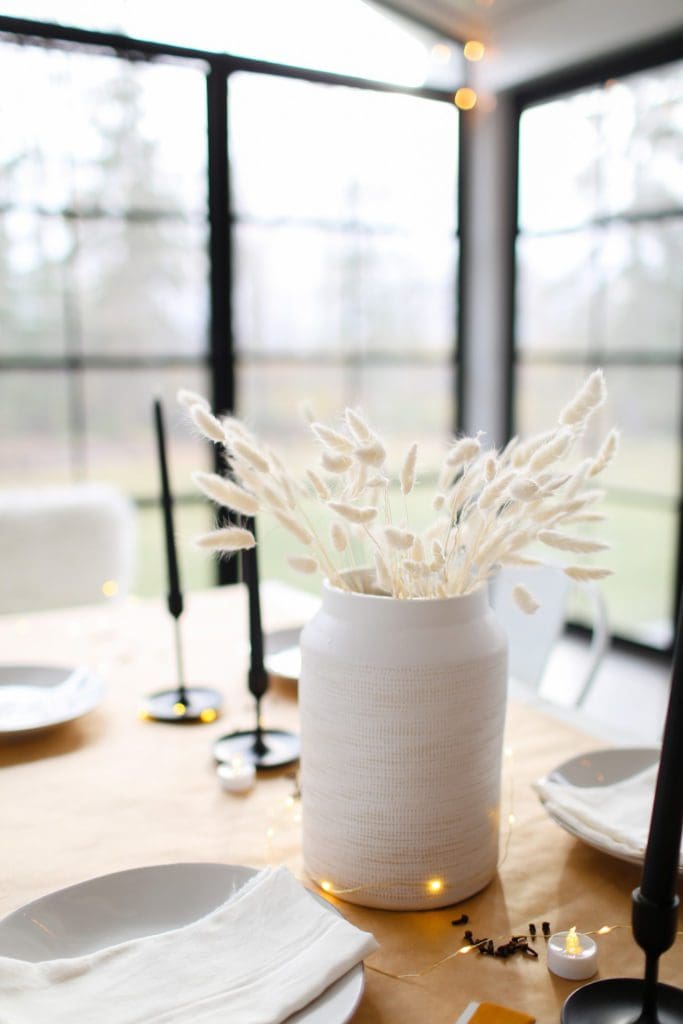 A vase of dried flowers on a table