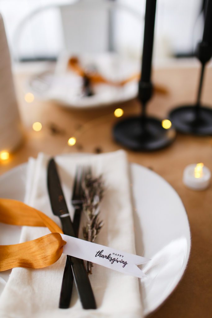 A plate with a fork and knife, with Table and Thanksgiving tag