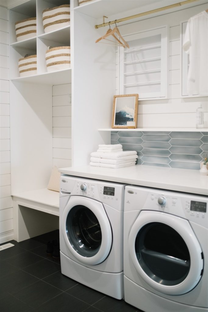 an entryway with washer and dryer
