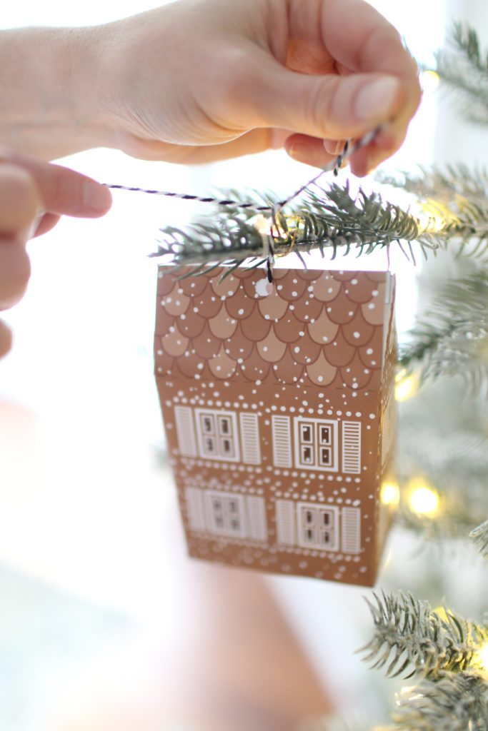 hanging gingerbread advent calendar gift boxes onto tree