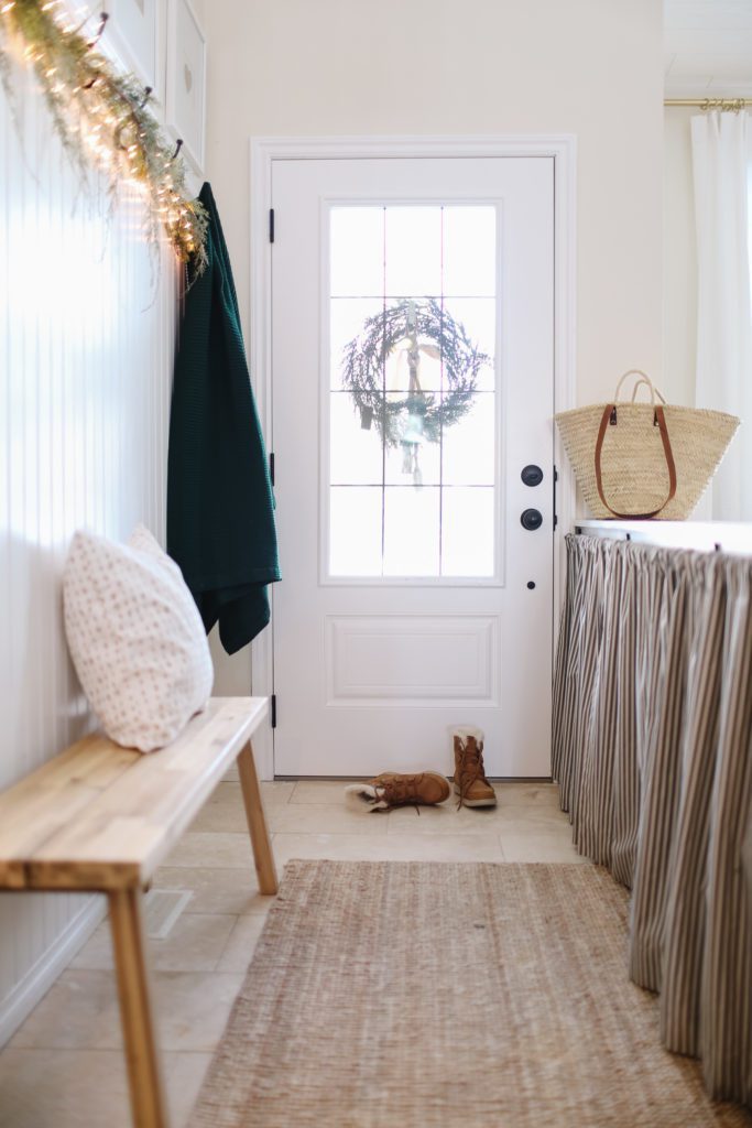 An entryway with ticking strips curtains