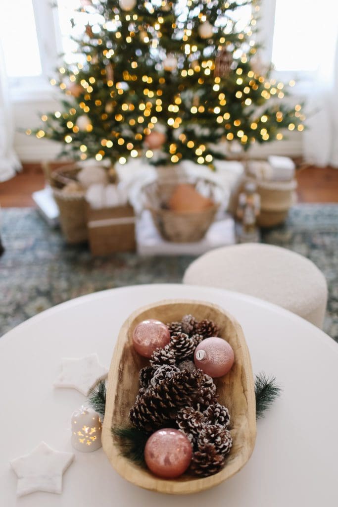 oink ornaments and pinecones in a bread bowl