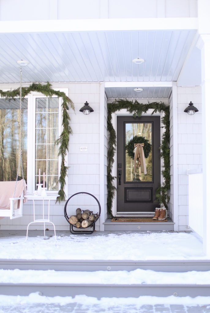 front porch with christmas garland
