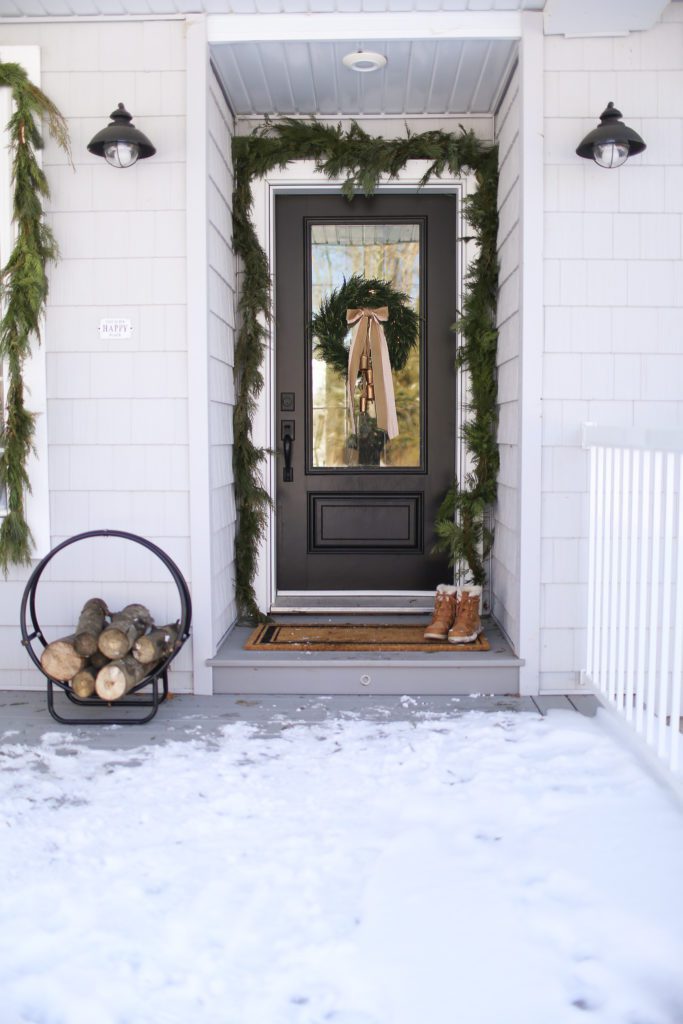 Front door with garland and wreath