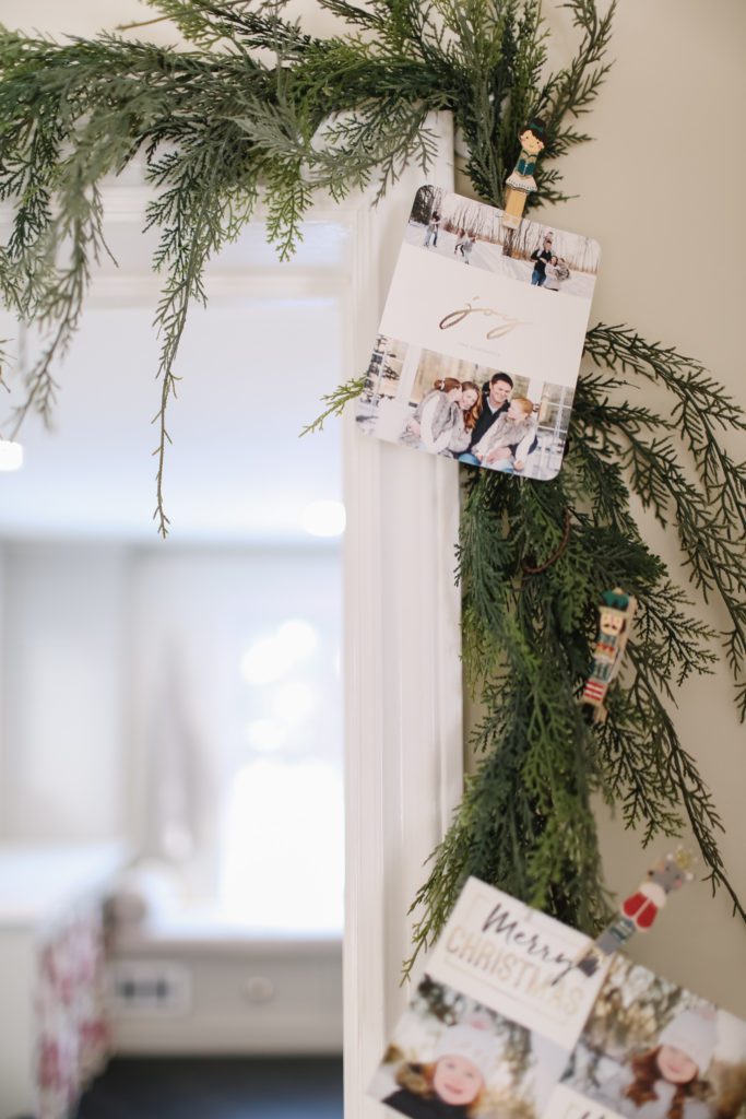Christmas card pegged on a green garland