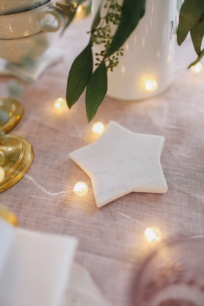 white marble star coaster and twinkle lights