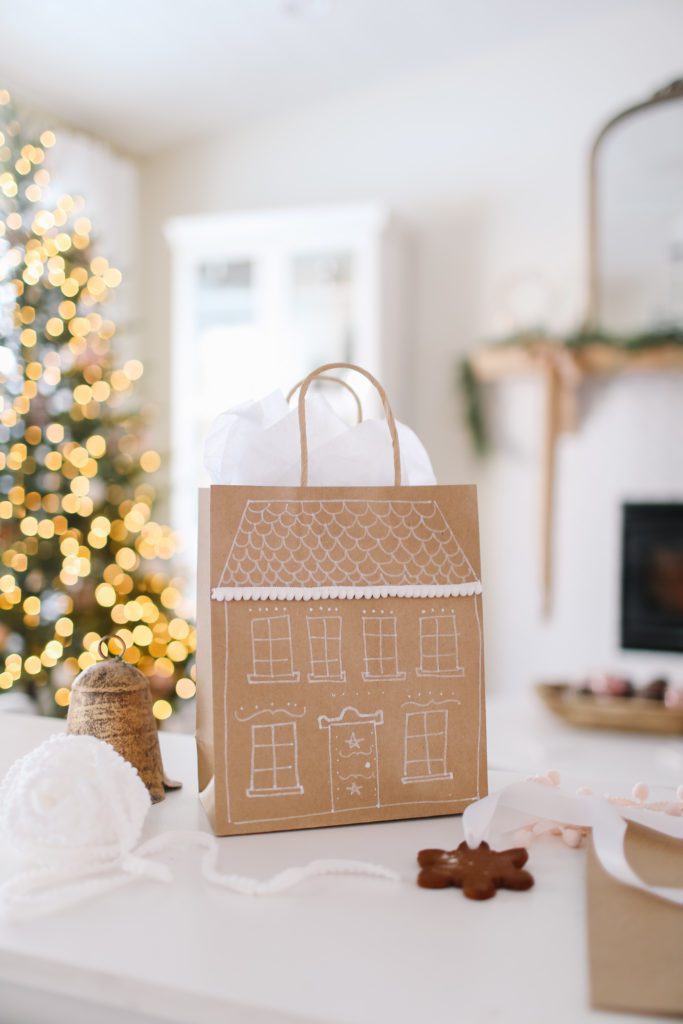 Paper gift bag decorated like a gingerbread house