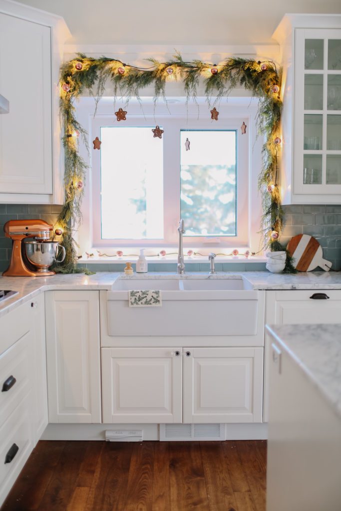 kitchen window with star gingerbread garland