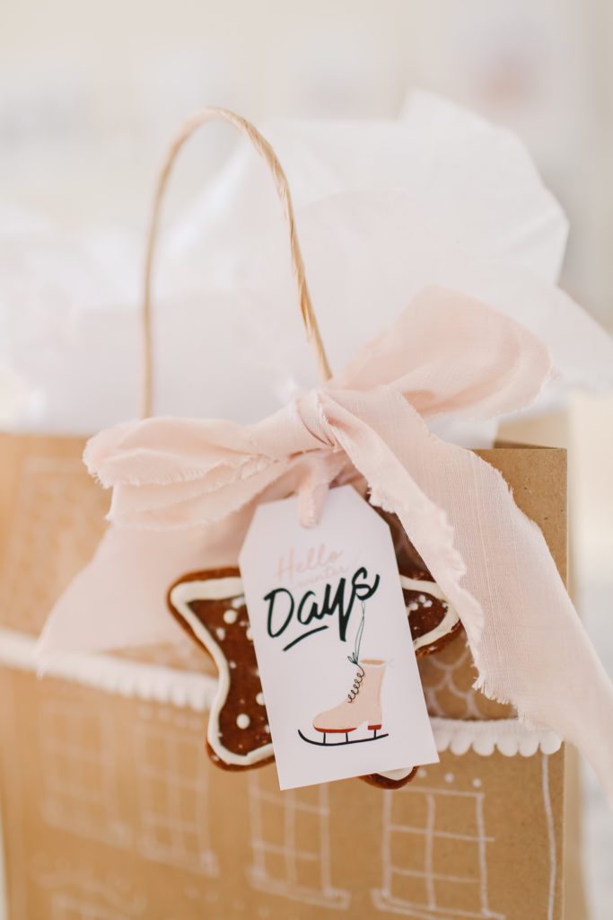 Gingerbread cookie gift tag tied with pink ribbon