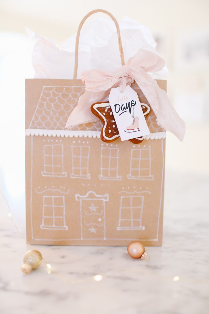 gift bag decorated like a gingerbread house with ginger cookie tag