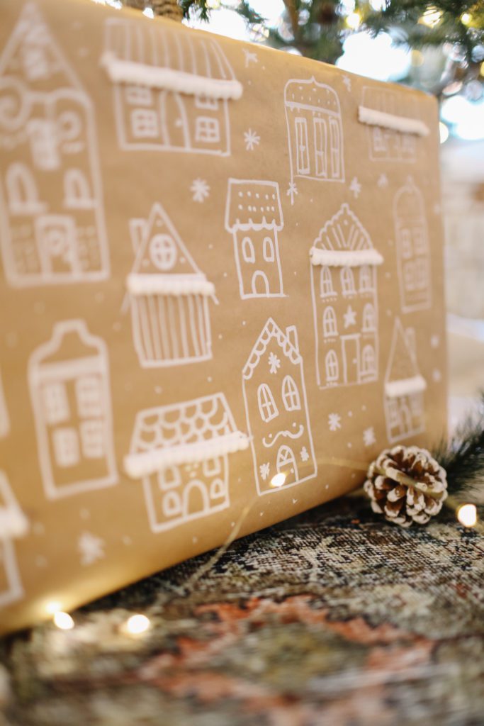 tiny gingerbread houses drawn on brown paper to make gift wrap